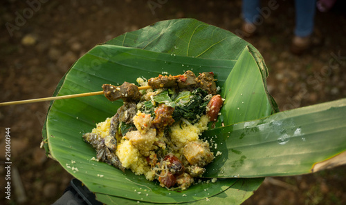 Nasi Jagung or corn rice in indonesia with banana leaf plate photo