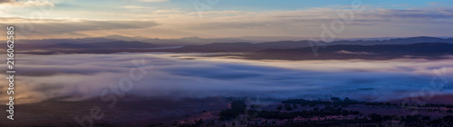 Large panorama of Flinders Ranges mountains covered in low clouds at sunrise in South Australia