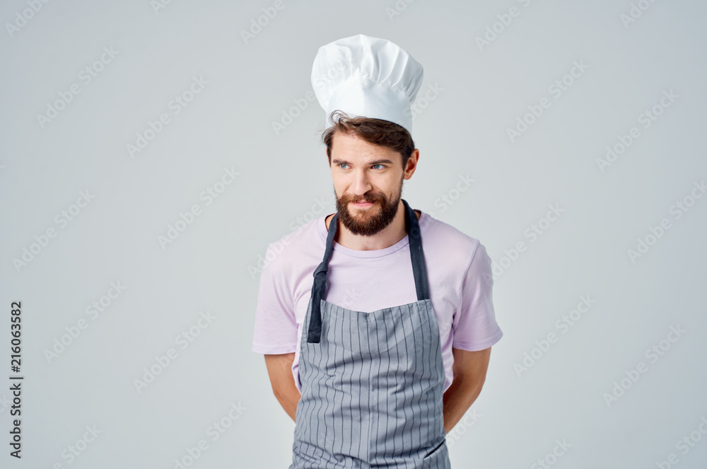 cook in uniform in the kitchen cook in uniform in the kitchen