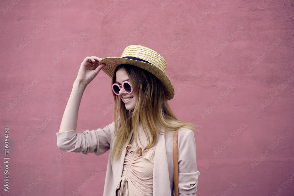 woman in hat with glasses smiling