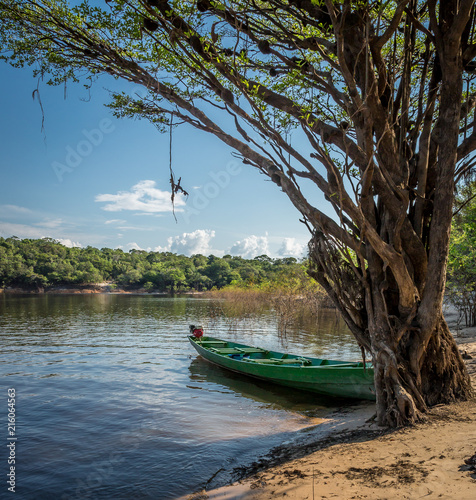 Flat river boat on shore of Rio Negro, Manaus, Brazil.CR2