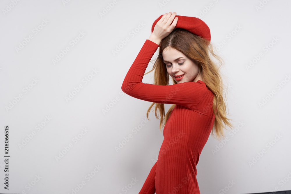 woman with closed eyes holds beret woman with closed eyes holds beret