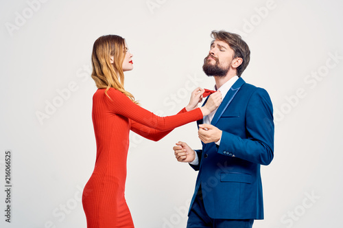 woman straightens tie man