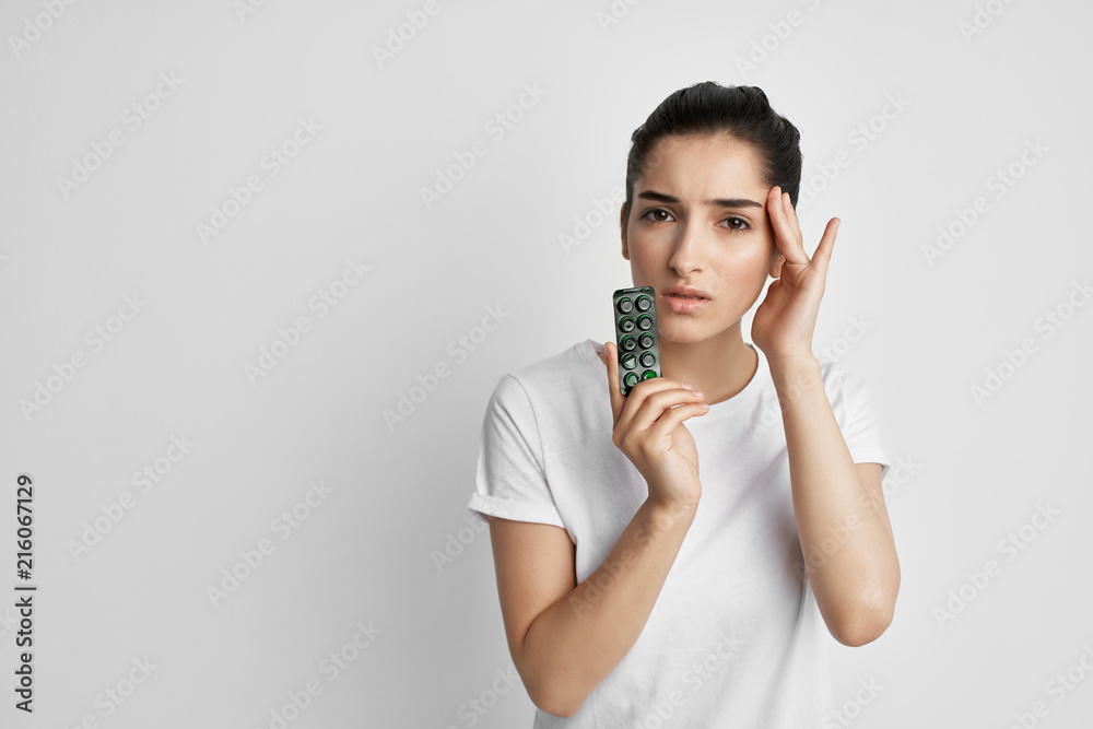 woman with pills headache