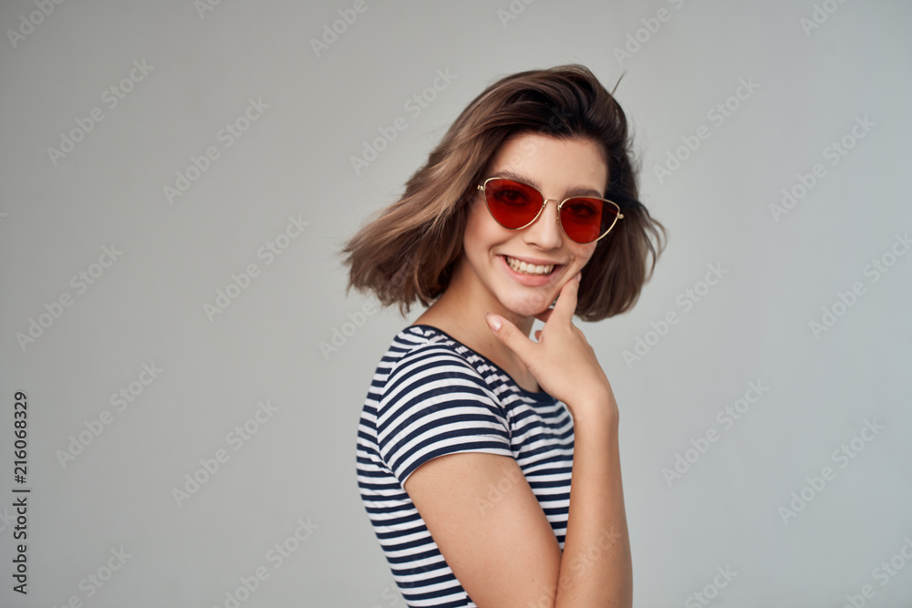woman with a short haircut in glasses smile woman with a short haircut in glasses smile
