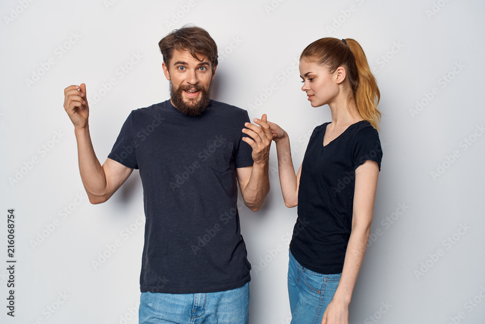 young couple in black t-shirts young couple in black t-shirts