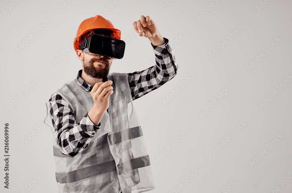 architect in a helmet in 3d glasses architect in a helmet in 3d glasses