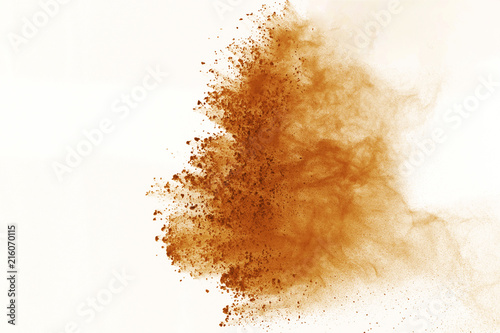 Brown powder explosion isolated on white background.  Colored cloud or dust splatted.