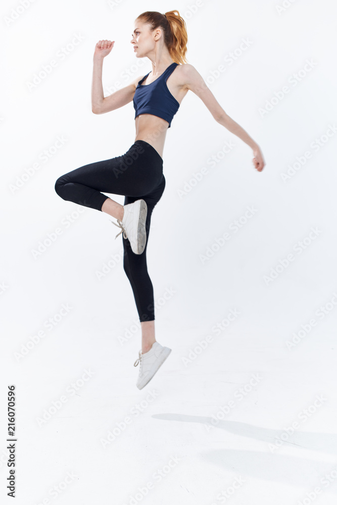 young woman jumping in the air