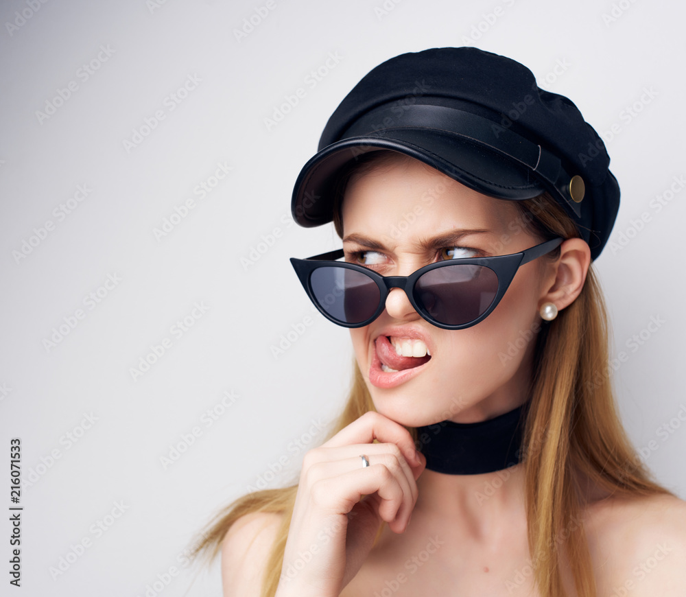 woman in a cap glasses shows language photo emotions portrait woman in a cap glasses shows language photo emotions portrait