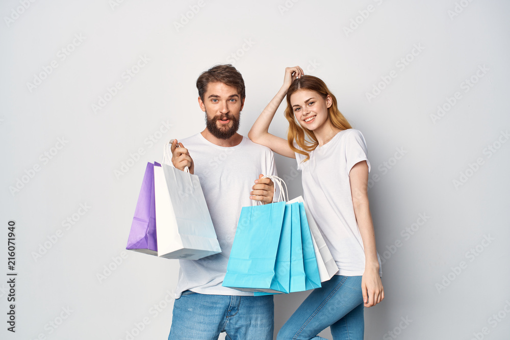 woman man with shopping bags isolated on white woman man with shopping bags isolated on white