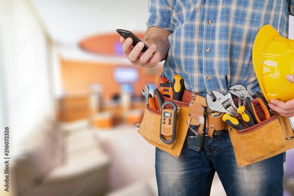 Worker with a tool belt Worker with a tool belt