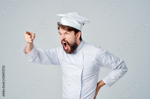 cook man with a beard shouts emotions