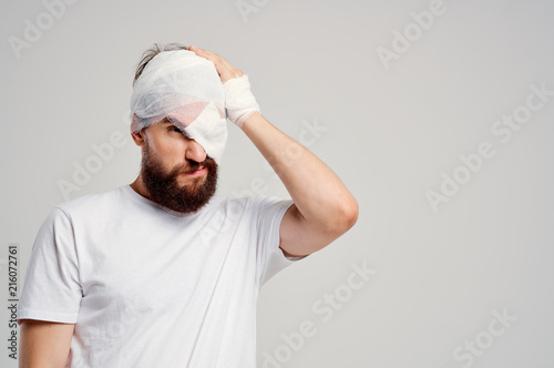 man with a bandage on his head