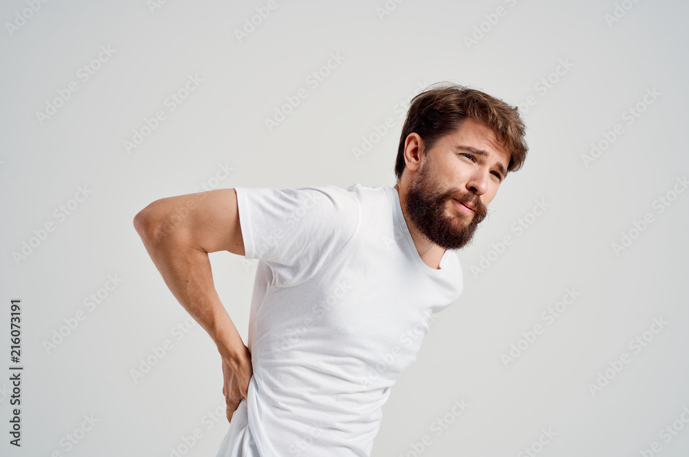 the man's back hurts the man's back hurts