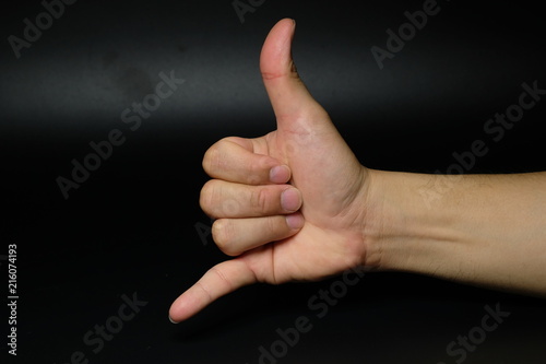 Man hand sign isolated on back background © วินนี่ พูล