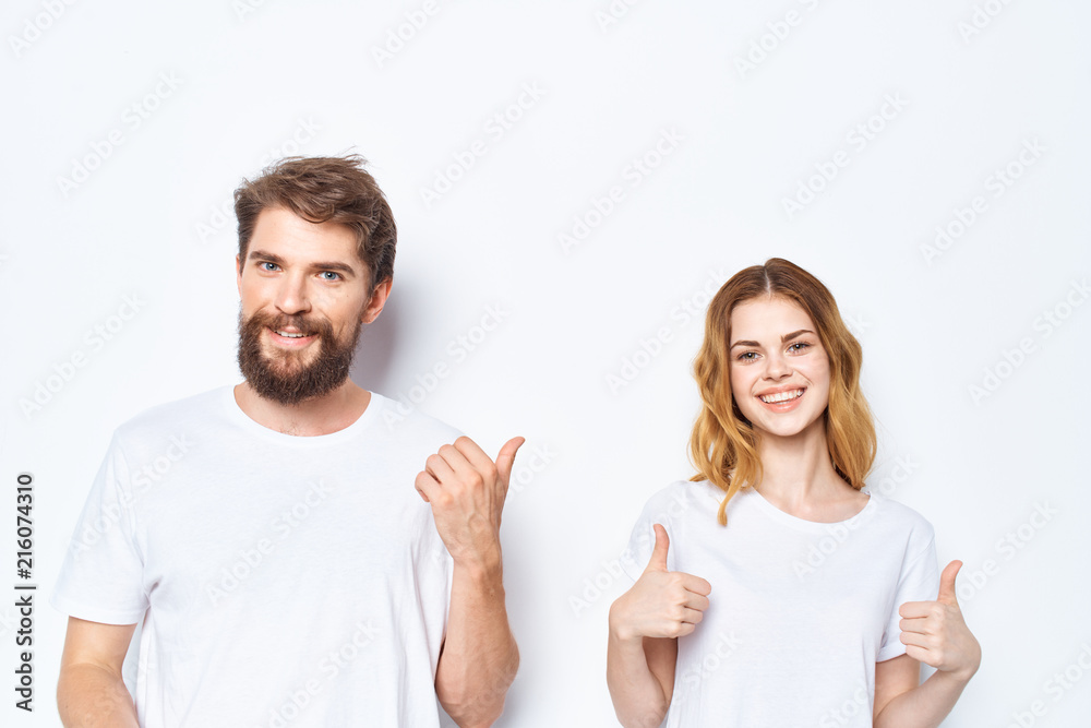 young couple showing thumbs up marks smile logo
