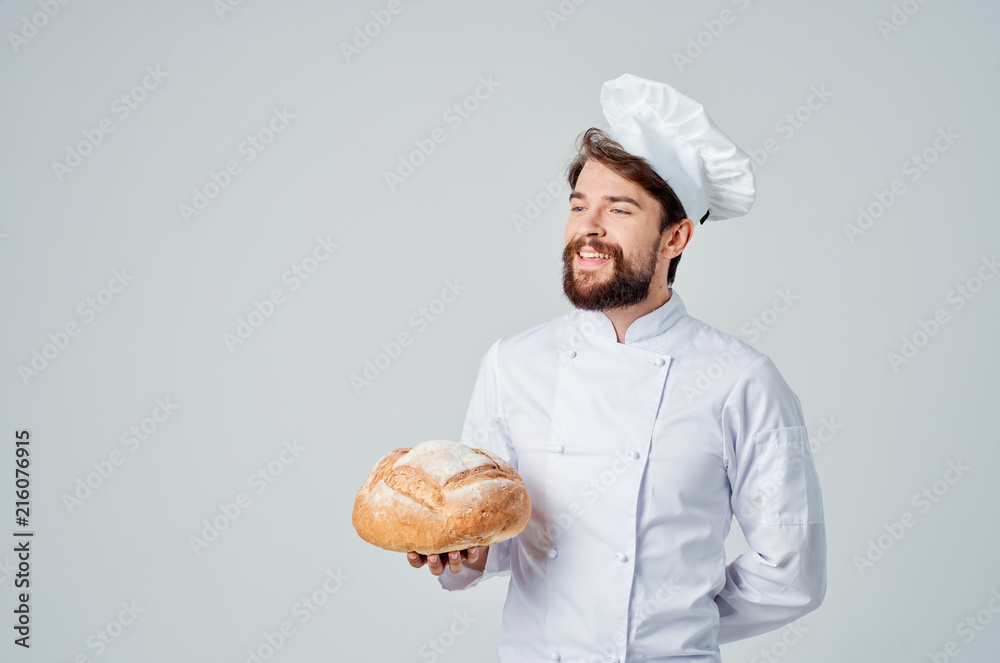 happy cook holding a round loaf of bread in his hand happy cook holding a round loaf of bread in his hand