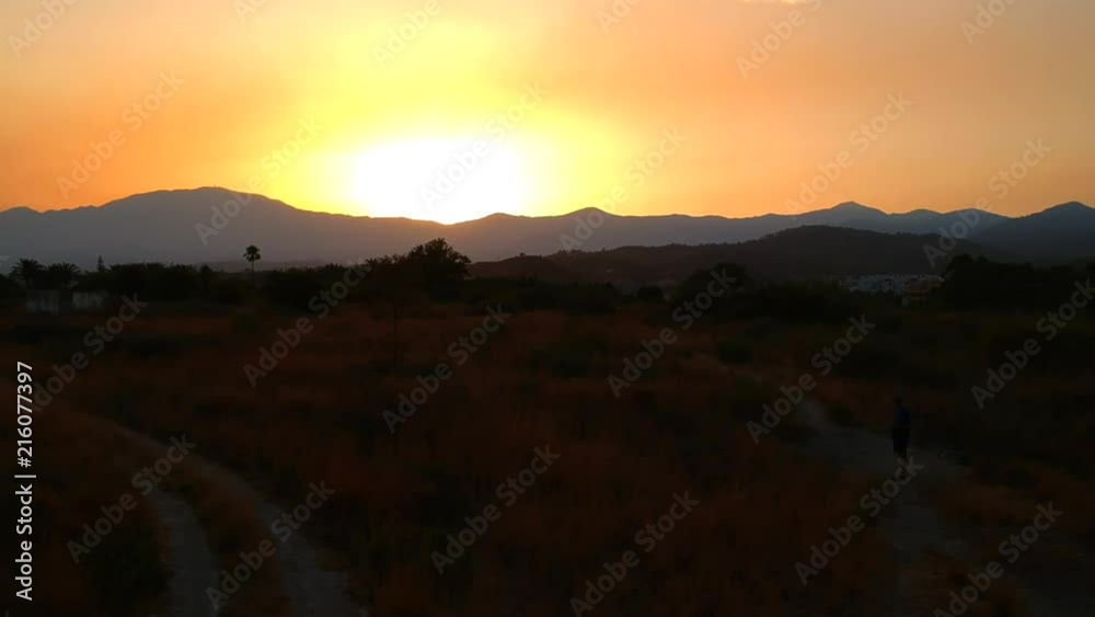 Summer evening sunset in Southern Spain, beautiful landscape images of the sun going down over the mountains in Southern Europe Summer evening sunset in Southern Spain, beautiful landscape images of the sun going down over the mountains in Southern Europe