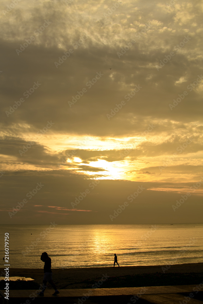 People stood watching the sea, Sunrise and happy