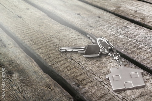 House keys on wooden floor background. © BillionPhotos.com