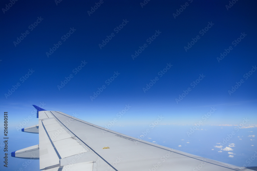 Wing airplane flying. View from the window airplane flying. Wing airplane flying. View from the window airplane flying.