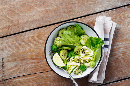 Healthy vegetarian salad green vegetables bowl top view