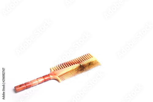 Hairbrush with hair isolated on white background