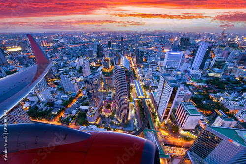 Fototapeta Naklejka Na Ścianę i Meble -  Travel transportation concept by Airplane is flying over Bangkok city skyline with beautiful landscape during at dusk.