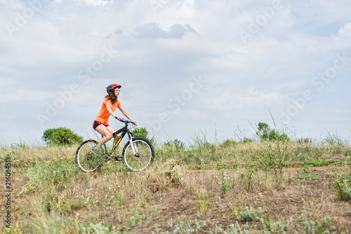 Young woman riding a mountain bike, an active lifestyle.