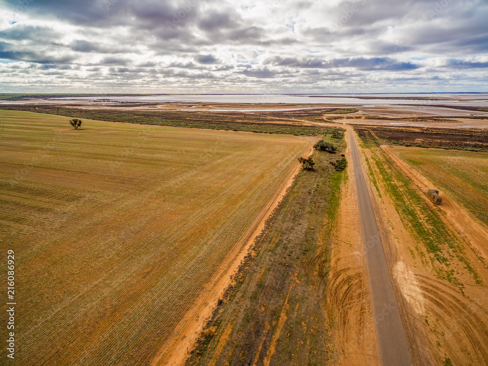 Gravel road leading to Lake Tyrrell in Victoria, Australia - aerial view
