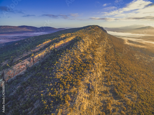 Aerial view of rugged cliff at sunrise. Flinders Ranges, South Australia © Greg Brave