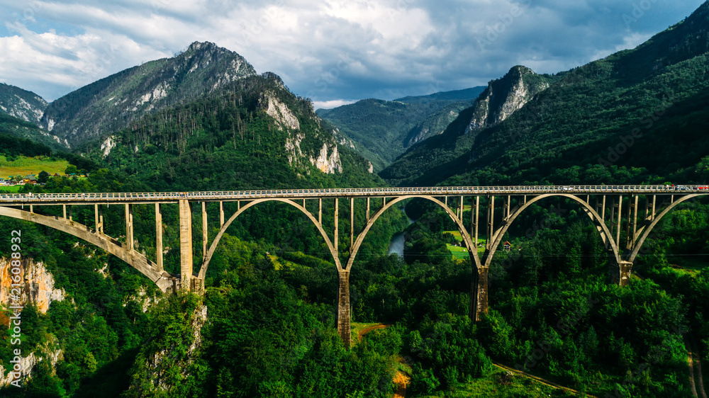 Aerial View of Durdevica Tara Arc Bridge in the Mountains, One of the Highest Automobile Bridges in Europe. Aerial View of Durdevica Tara Arc Bridge in the Mountains, One of the Highest Automobile Bridges in Europe.