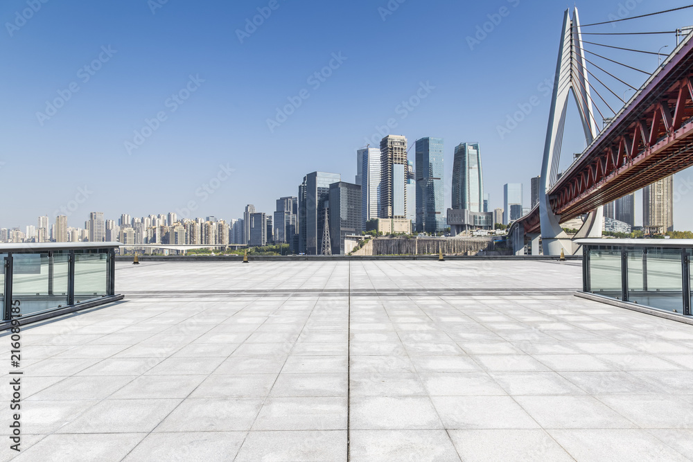 Panoramic skyline and modern business office buildings with empty road,empty concrete square floor