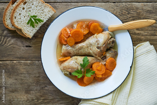 Stewed chicken legs with carrots