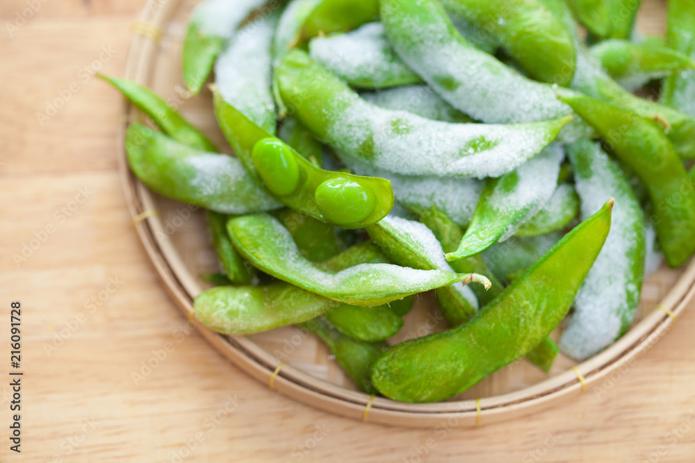 studio shot of Japanese style boiled beans EDAMAME on basket.. studio shot of Japanese style boiled beans EDAMAME on basket..