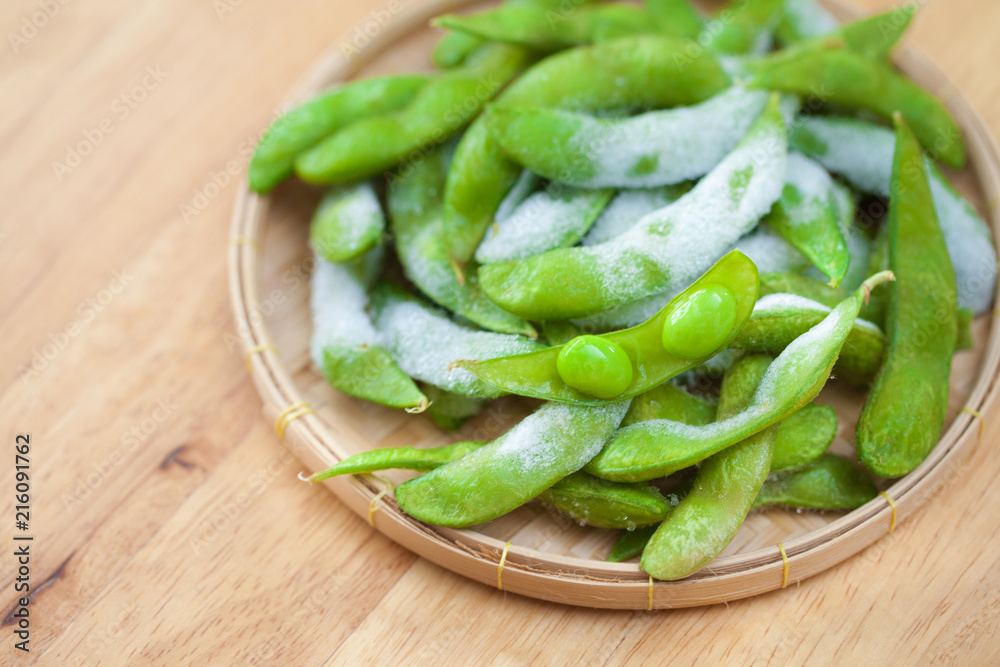 studio shot of Japanese style boiled beans EDAMAME on basket.. studio shot of Japanese style boiled beans EDAMAME on basket..