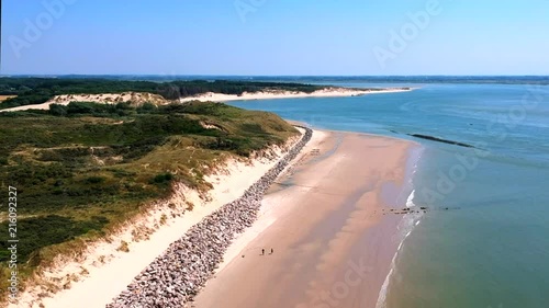 Drone footage of the dunes, beach and sea of Berck-Plage, France. photo