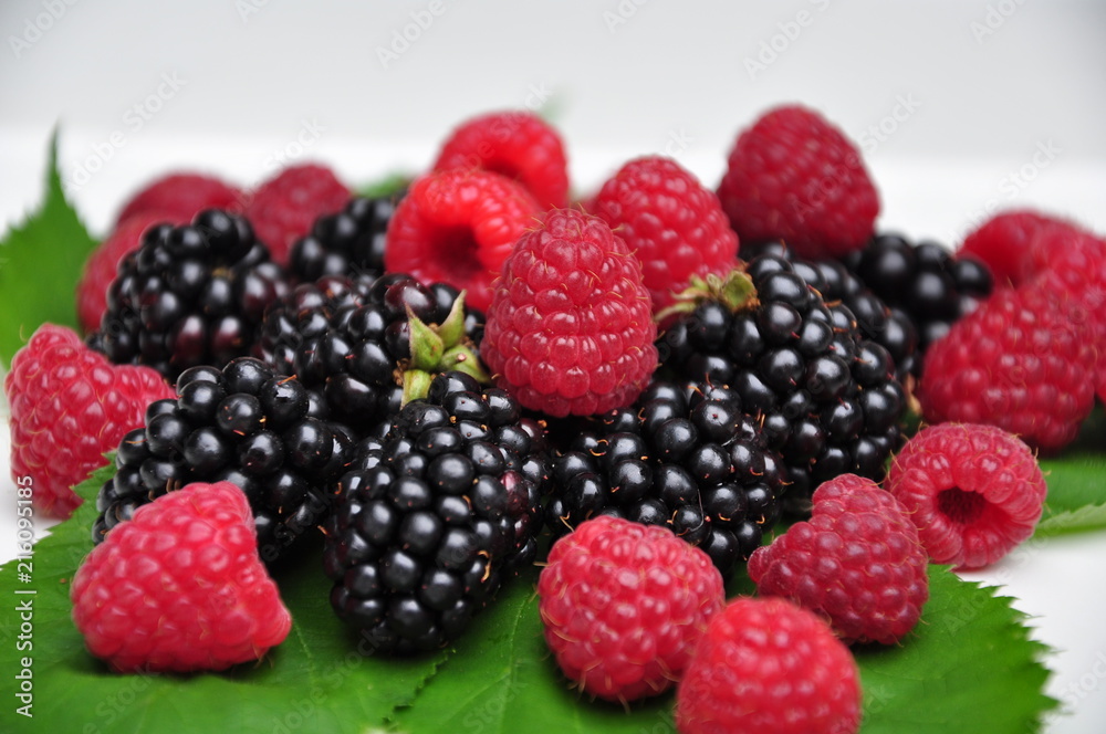 close up of red and black raspberries isolated whited background close up of red and black raspberries isolated whited background