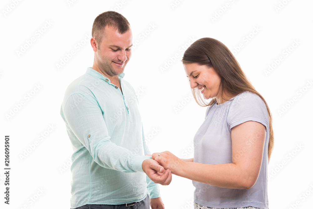 Portrait of young happy couple arranging shirt sleeve gesture Portrait of young happy couple arranging shirt sleeve gesture