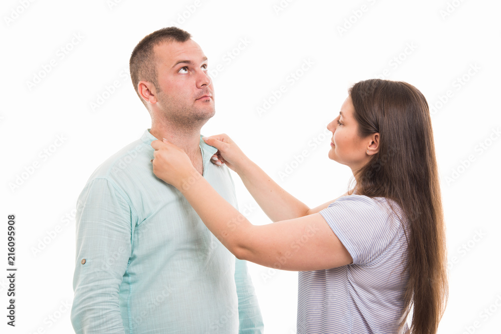 Portrait of young happy couple arranging shirt collar gesture Portrait of young happy couple arranging shirt collar gesture