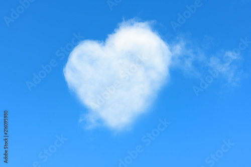 It is beautiful natural cloud in a form of a heart in a blue sky. It is the concept of unearthly love and passion, sublime feelings.