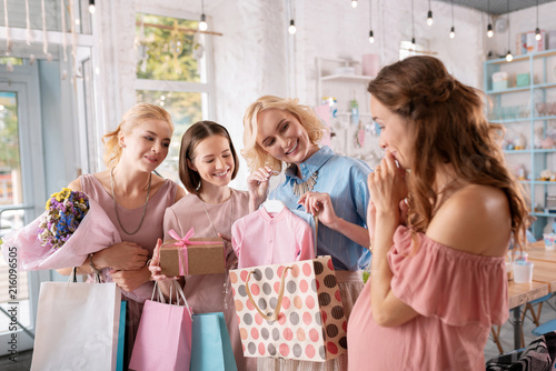 Joyful communication. Pregnant woman enjoying communication with her devoted friends