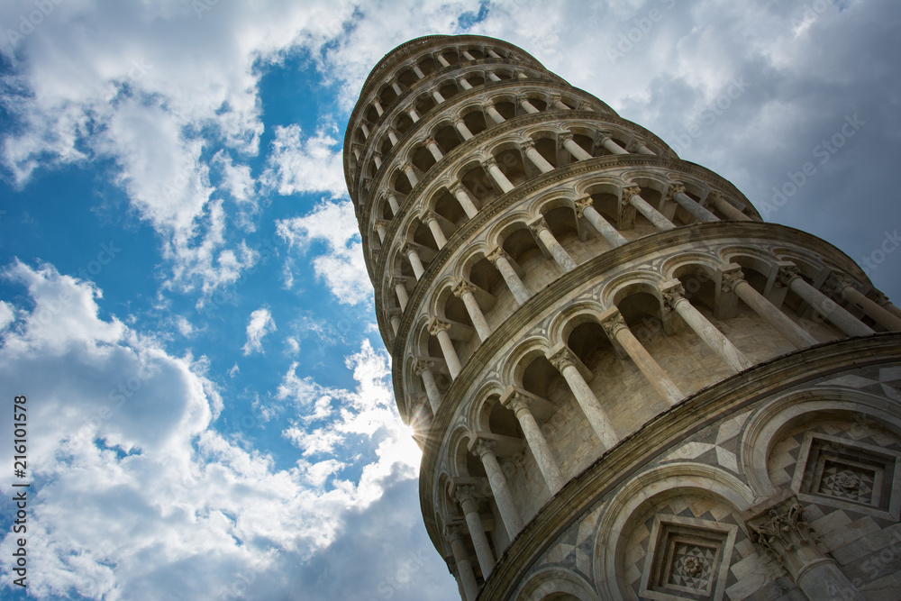The Leaning Tower of Pisa, Italy, famous for its tilt, with the cloudy sky. A bell tower of the nearby Pisa Cathedral, it is one of the most popular tourist attractions in Tuscany and even Italy