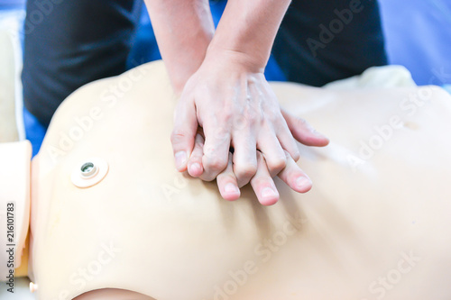 Basic Life Support of Demonstrating chest compressions on CPR doll