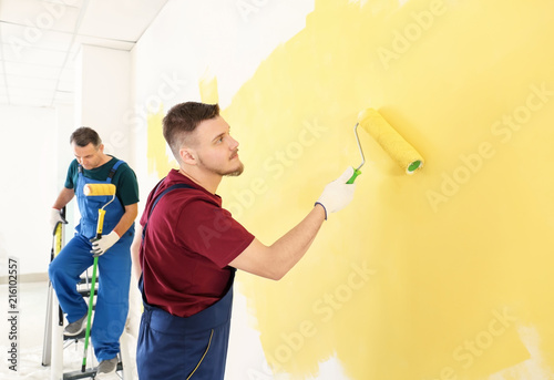Male painters in uniform wo...