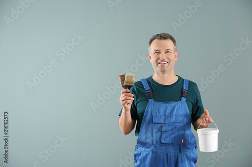 Male painter in uniform wit...
