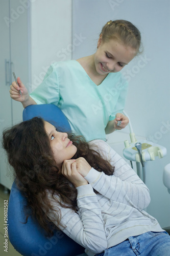 Playing dentist in the dental office.