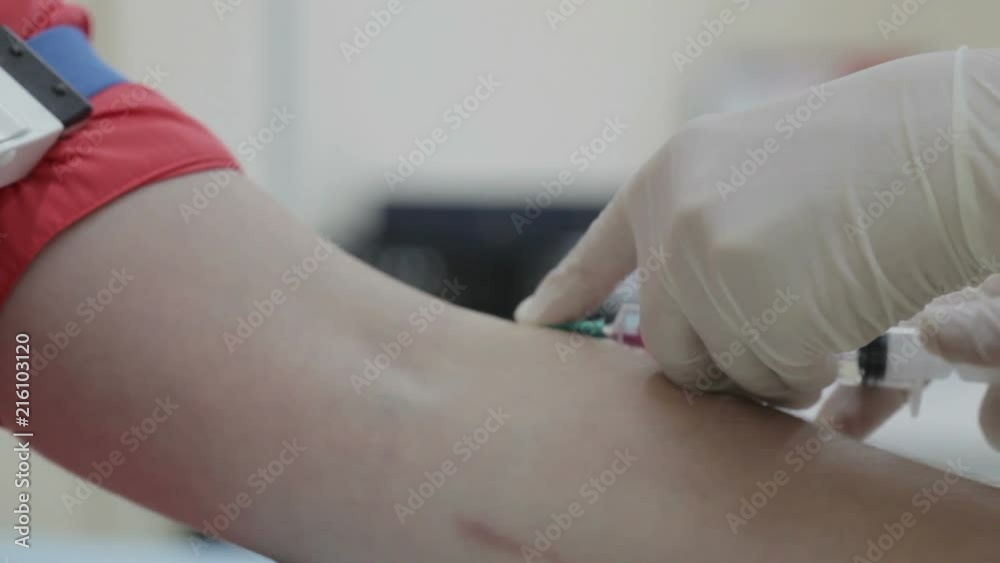 Doctor making injections young woman hand Doctor making injections young woman hand
