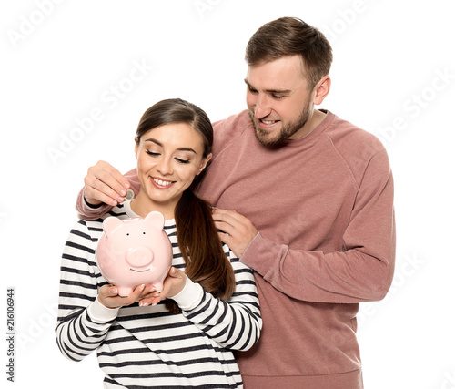Happy couple with piggy ban...